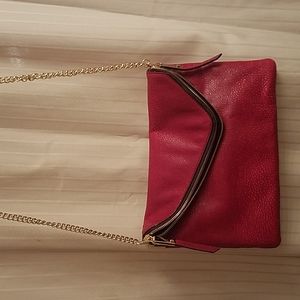 Henri Bendel  crosdbody clutch type bag in red w gold trim / embellishments